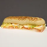 Zdjęcie produktu "tania buła" swojska-jasny paluch z szynką, serem, jajkiem i sałatą